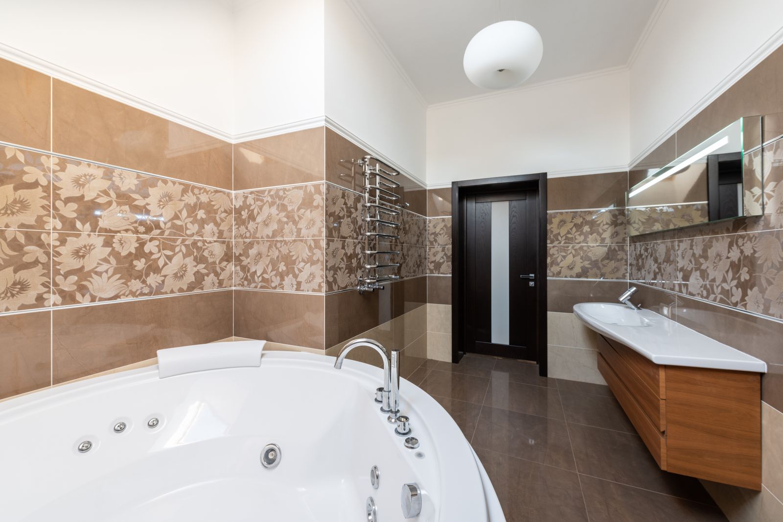 The finished Montford bathroom with handmade ceramic tile and the original hex floor